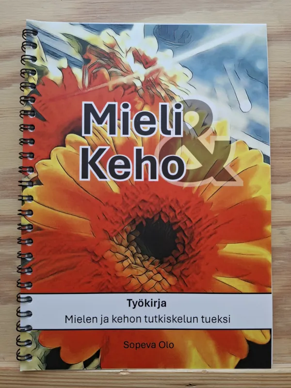 Sopeva Olon Mieli ja keho -työkirjan kansikuva värikkäällä kukkakoristeella.